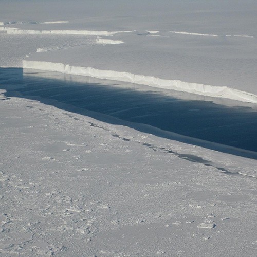 A large river of melt water runs through the Venable Ice Shelf in West Antartica. Photo courtesy NASA/JPL-Caltech/UC Irvine